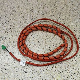 Orange cable with fabric wrap used to heat a drain hose