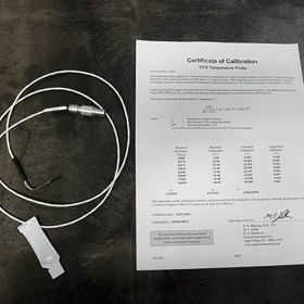 Tempearture probe with paper stating Certicate of Calibration.